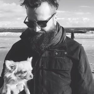 Man on beach with chihuahua Timm Cleasby commercial photographer Sheffield