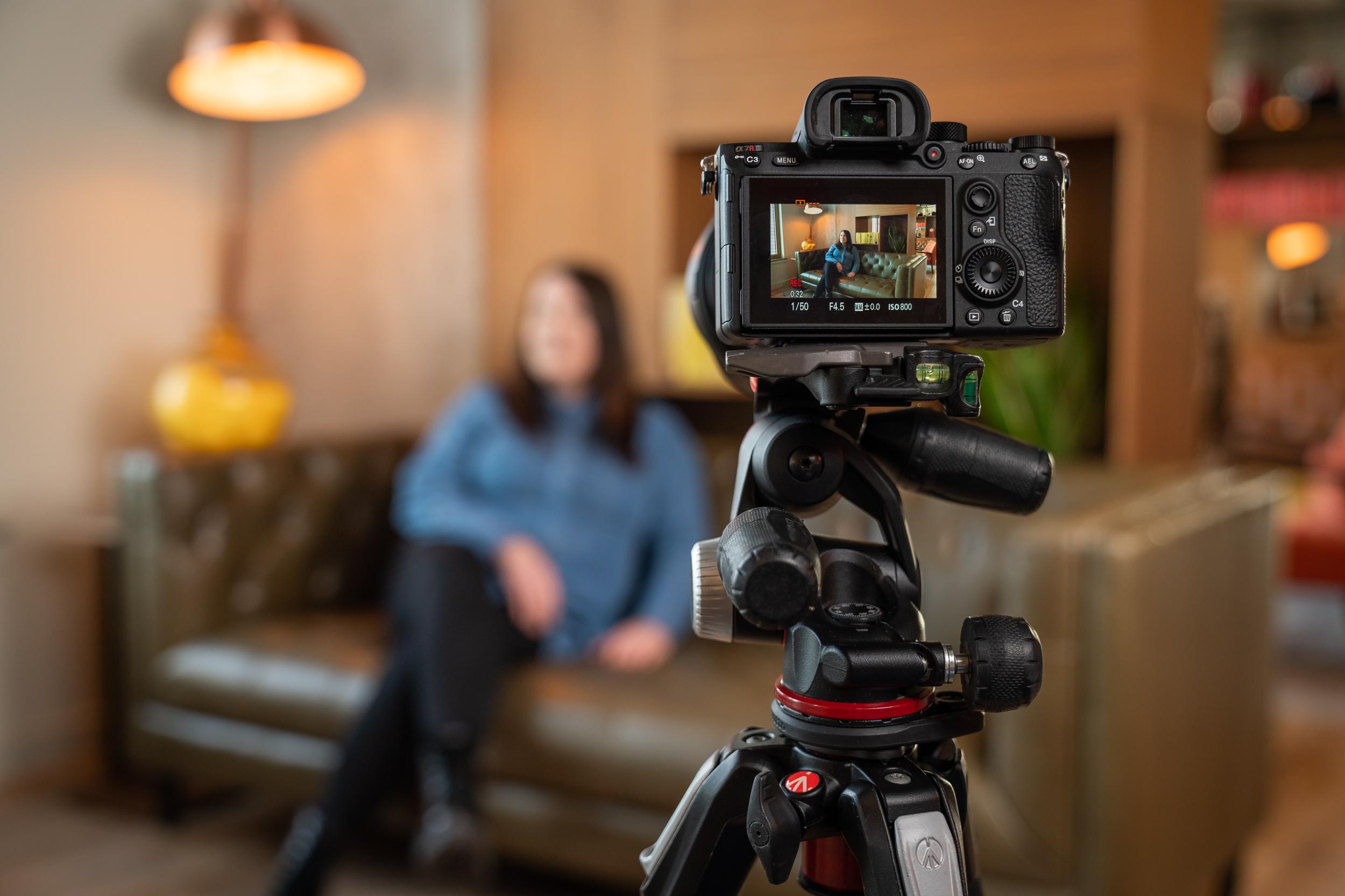 woman, interview, filming, camera