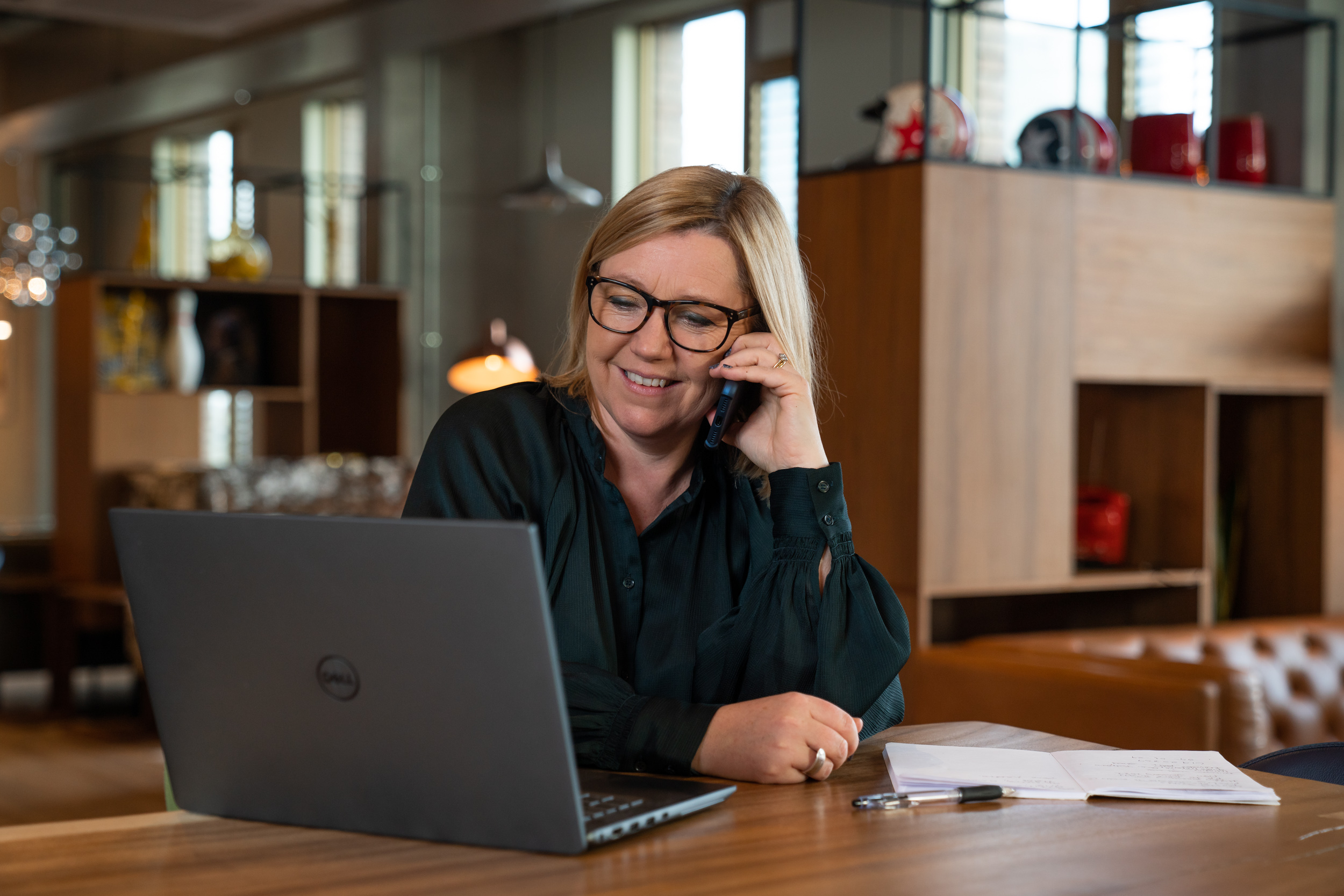 middle aged woman with glassers, on phone, using laptop, working, portrait, business portrait